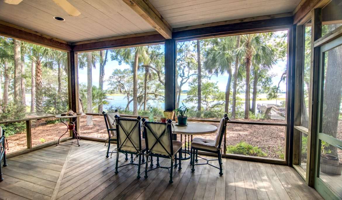 rustic-porch-with-forest-and-waterfront-view-PFFES9X.jpg